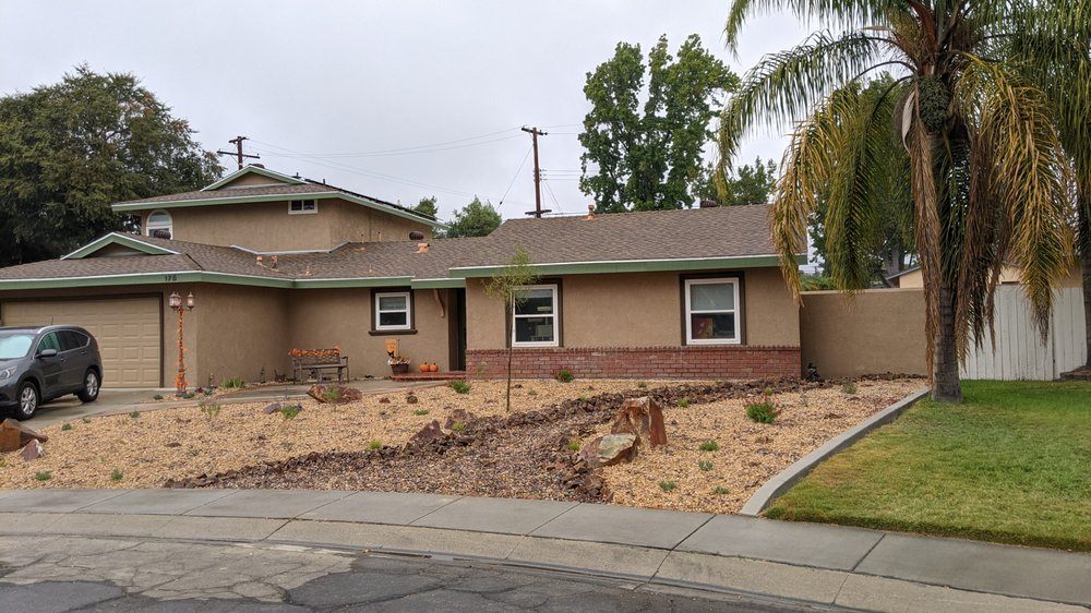 Drought-tolerant front yard with granite, boulders and succulents